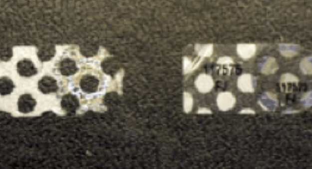 MLB authentication holograms showing the honeycomb tamper pattern left behind after removal